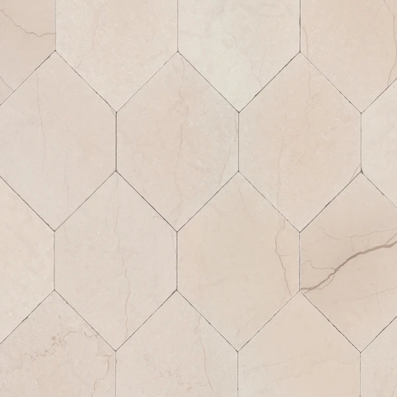 Beige Suave Tumbled Lynx marble mosaic with elongated hexagon tiles and subtle natural veining.