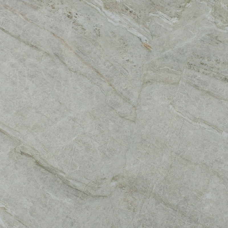 Taj Perla Rocca leathered quartzite slab with soft grey-beige tones and diagonal natural veining.