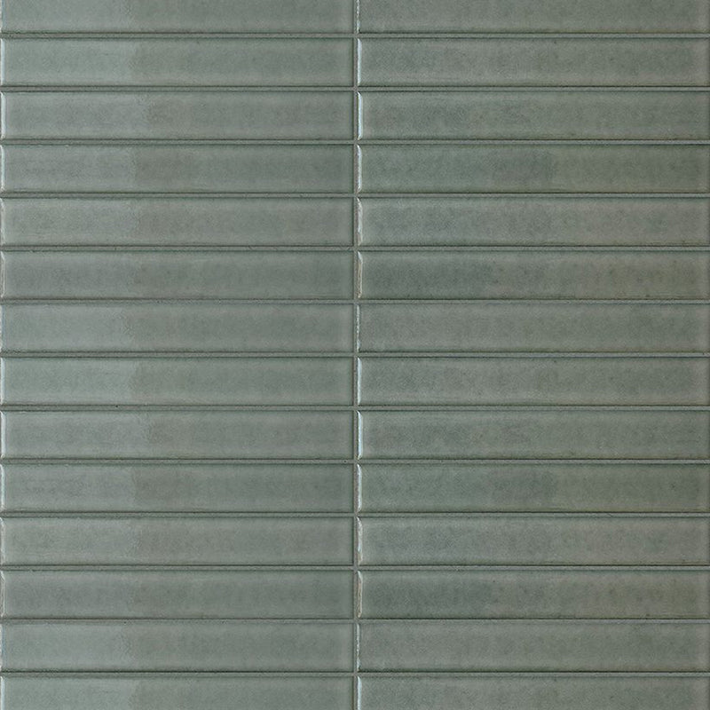 Terratinta Sticks Willow Green 1x6 Glossy Ceramic Mosaic Tile with slender green pieces arranged in horizontal rows.