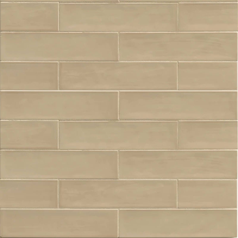 Tongue in Chic Cut Me Some Flax 10.5x2.5 ceramic wall tile in a staggered beige pattern.