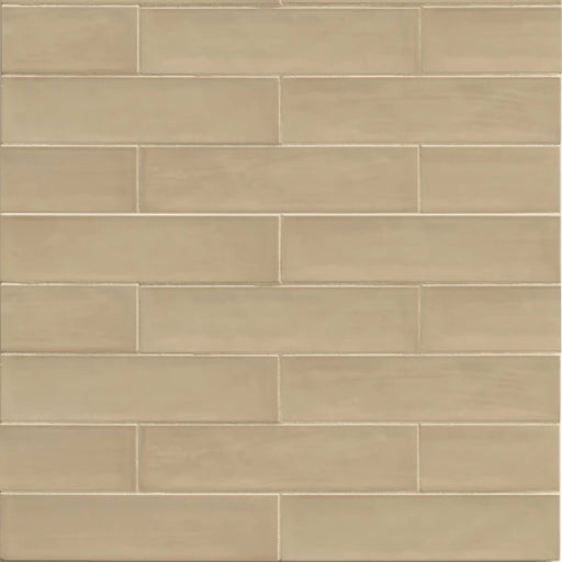 Tongue in Chic Cut Me Some Flax 10.5x2.5 ceramic wall tile in a staggered beige pattern.