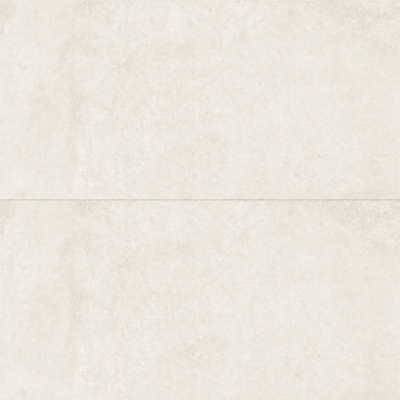 Two Unicom Oxid Titanium 24x48 matte porcelain tiles with a light beige mottled surface, arranged horizontally.