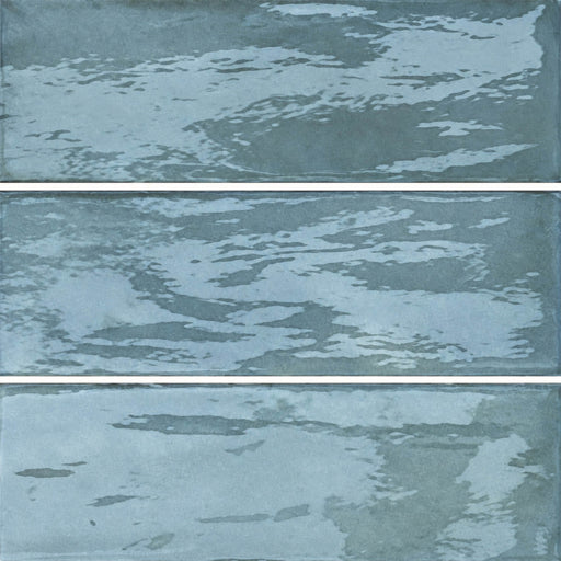Valsecchia Candy Water glossy porcelain tiles with blue-green glaze variation in a horizontal panel layout.