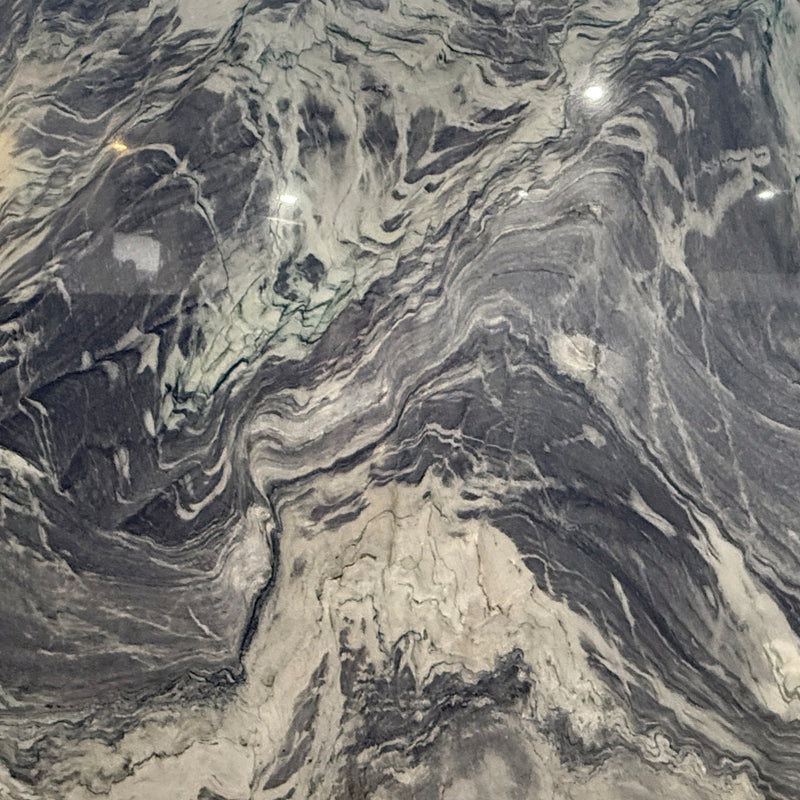 Van Gogh 3cm Polished Quartzite Slabs with dramatic charcoal gray and cream bands and intricate flowing veining.