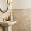 Walnut Travertine 3x6 Honed Travertine Tile — Powder Room wainscot