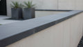 Close-up of Indian Black Limestone Natural 12 x 24 x 2 Limestone Wall Cap Cap, in Indian Black tones.