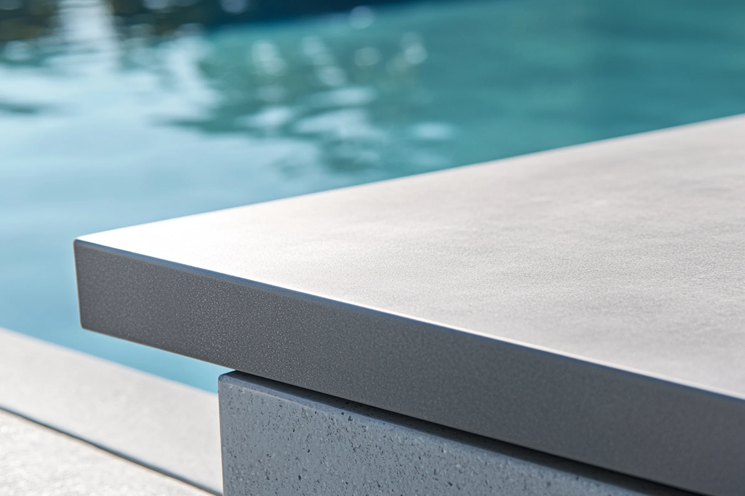 Curved and straight coping options in stone and concrete materials